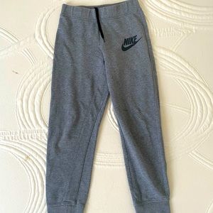 Gray Nike sweatpants. Adjustable with laces on waist.